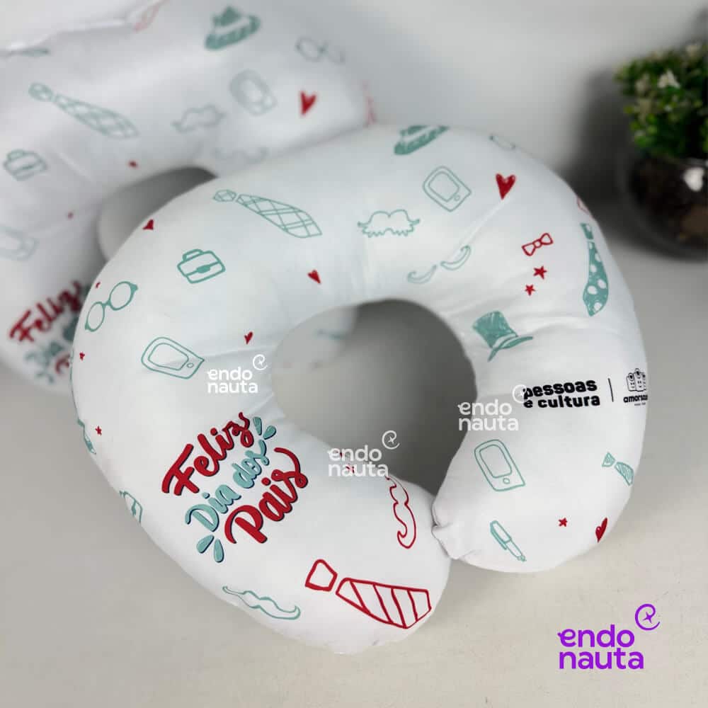 a white neck pillow with designs on it